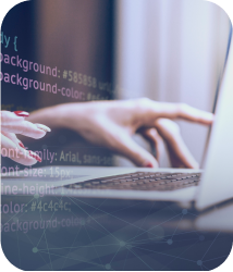 Hands typing on a laptop with code projected over the image. The scene conveys a focused and tech-savvy atmosphere, highlighting programming and digital work.